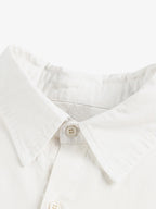 Stylish White Button-Up Shirt with Unique Patch Design for Casual and Trendy Looks 